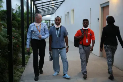 Men with Dr. Paul Farmer in Haiti